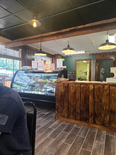 The cafe counter and deli case inside the store.