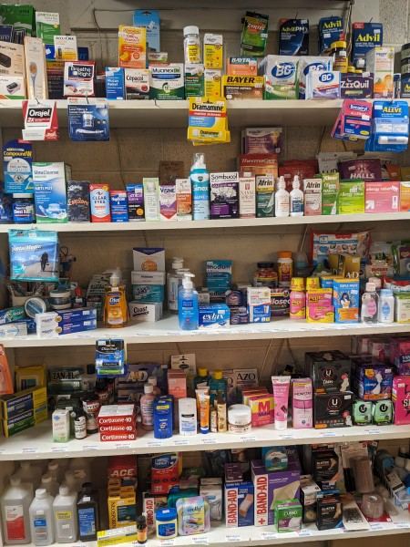 Health care and hygiene products on store shelves.