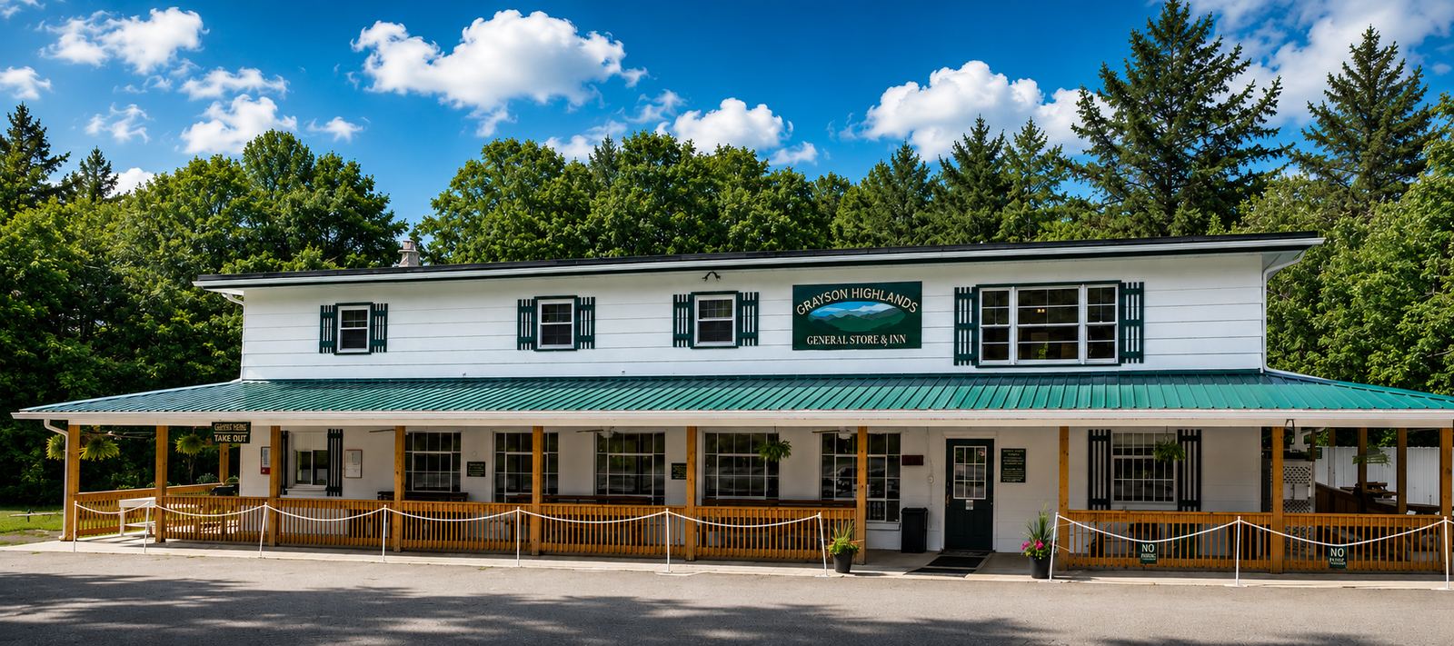 The Grayson Highlands General Store & Inn building along the highway, with mountains beyond.